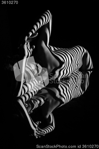 Image of The nude woman with black and white zebra stripes