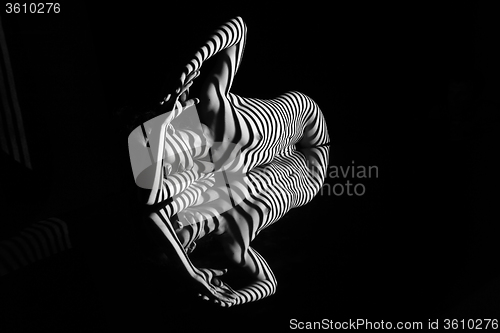 Image of The nude woman with black and white zebra stripes