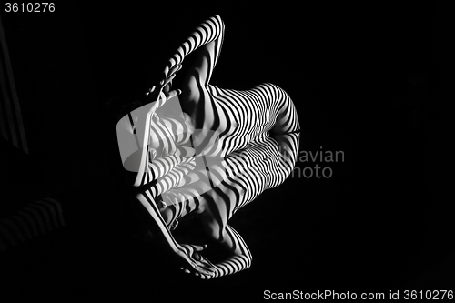 Image of The nude woman with black and white zebra stripes