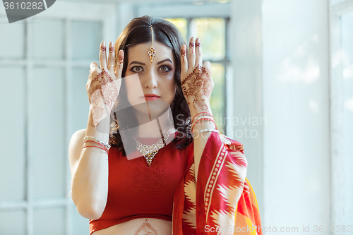 Image of Indian picture on woman hands, mehendi tradition decoration