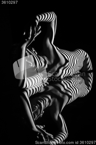 Image of The nude woman with black and white zebra stripes