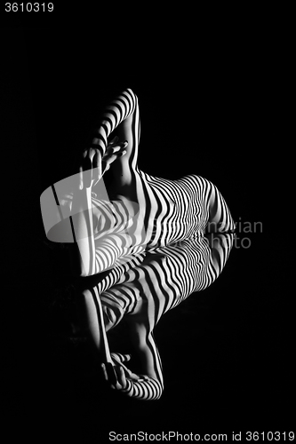 Image of The nude woman with black and white zebra stripes