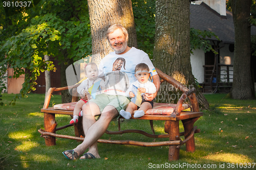 Image of Babys, less than a year old and their grandfather