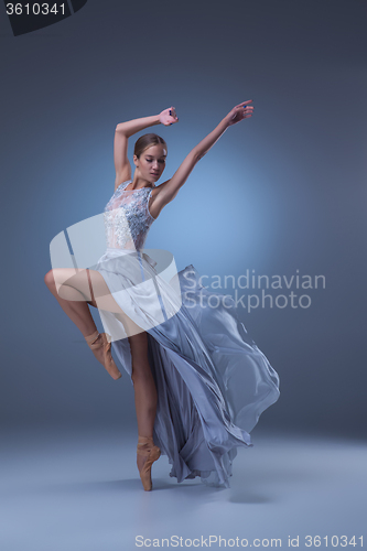 Image of The beautiful ballerina dancing in blue long dress 