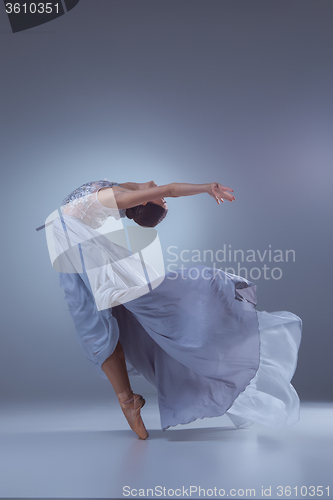 Image of The beautiful ballerina dancing in blue long dress 