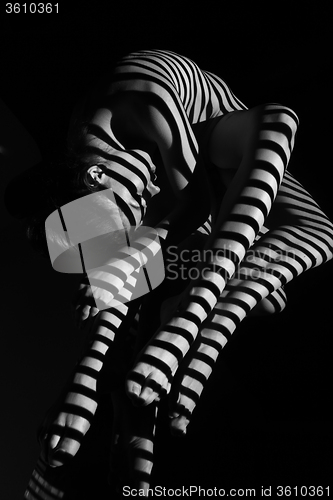 Image of The nude woman with black and white zebra stripes