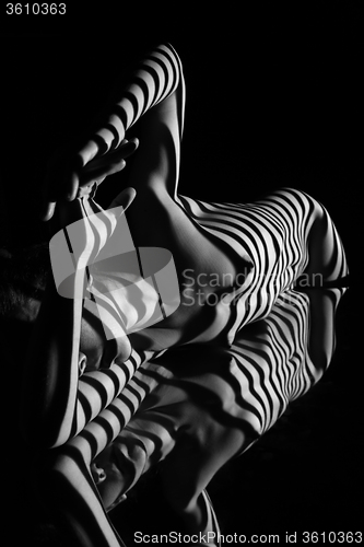 Image of The nude woman with black and white zebra stripes