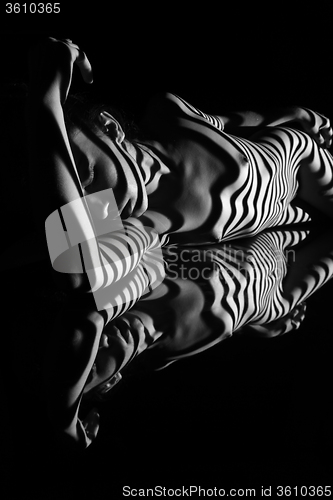 Image of The nude woman with black and white zebra stripes