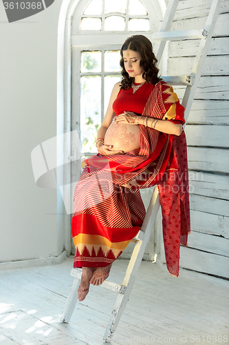 Image of Indian picture on woman decorated with indian mehandi painted henna 