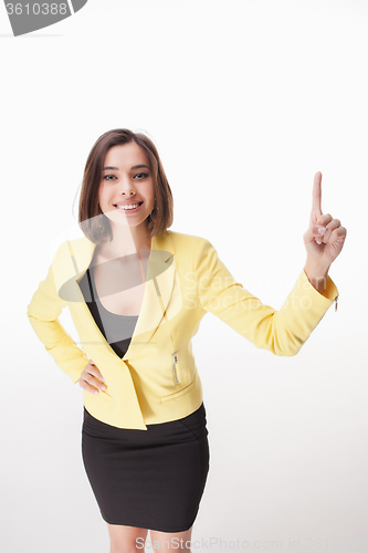 Image of young business woman showing something on the white background