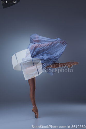 Image of The beautiful ballerina dancing in blue long dress 