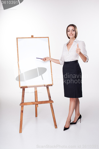 Image of young business woman showing something on the white background