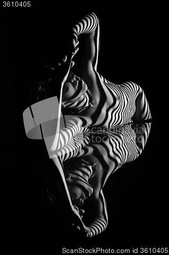 Image of The nude woman with black and white zebra stripes