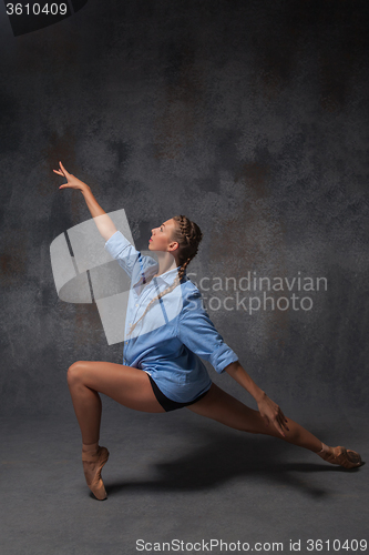 Image of Young beautiful modern style dancer posing on a studio background
