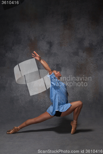 Image of Young beautiful modern style dancer posing on a studio background