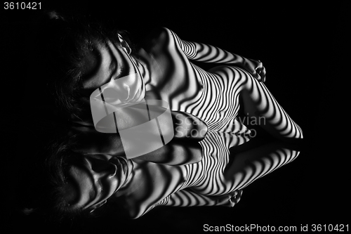 Image of The nude woman with black and white zebra stripes