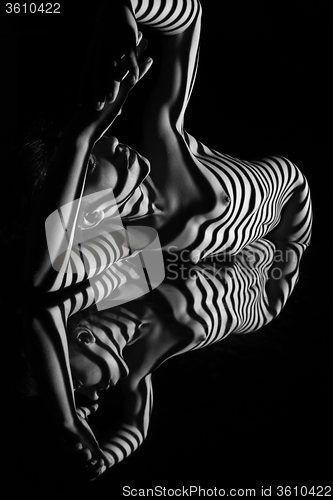 Image of The nude woman with black and white zebra stripes