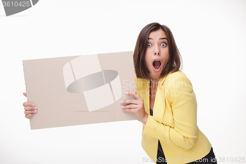 Image of Businesswoman showing board or banner with copy space on white background 