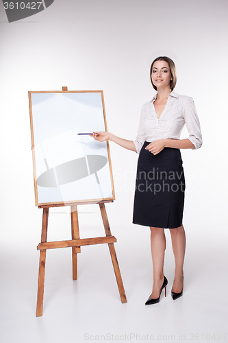 Image of young business woman showing something on the white background