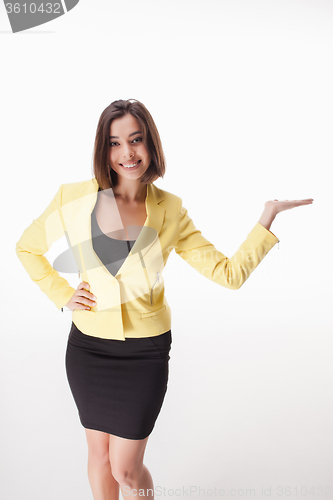 Image of young business woman showing something on the white background