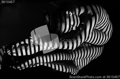 Image of The nude woman with black and white zebra stripes