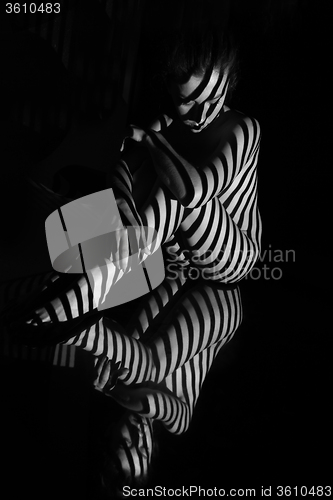 Image of The nude woman with black and white zebra stripes