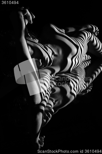 Image of The nude woman with black and white zebra stripes