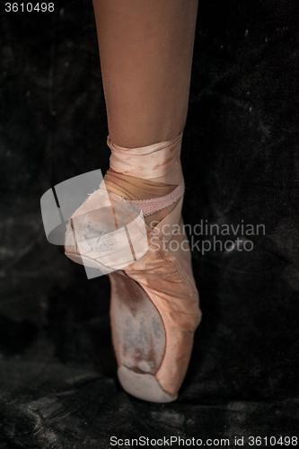 Image of The close-up  foot of young ballerina in  old pointe shoes 