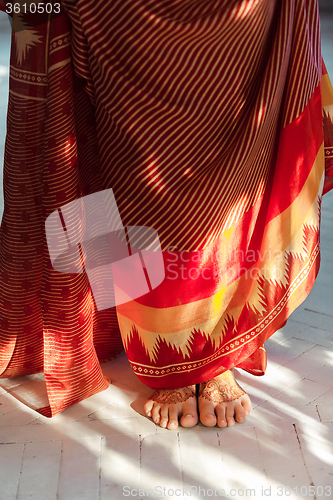 Image of Legs decorated with indian mehandi painted henna 