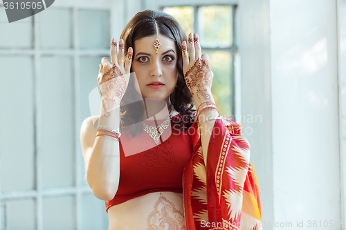 Image of Indian picture on woman hands, mehendi tradition decoration