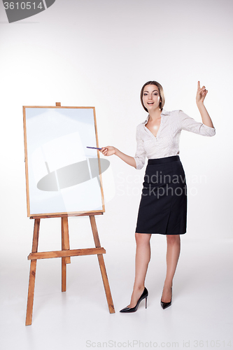 Image of young business woman showing something on the white background