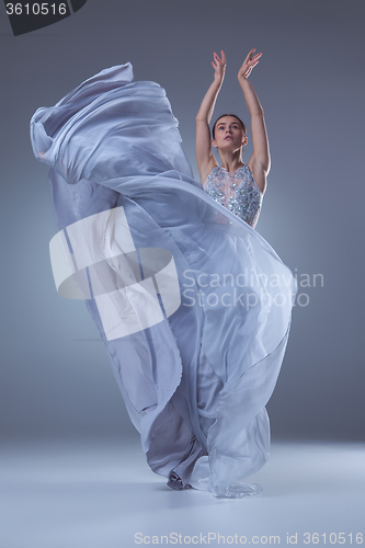 Image of The beautiful ballerina dancing in blue long dress 