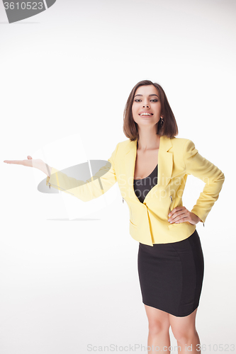 Image of young business woman showing something on the white background