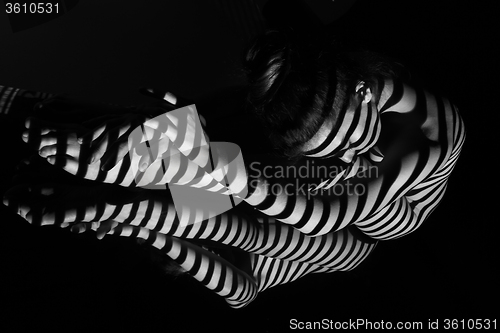 Image of The nude woman with black and white zebra stripes