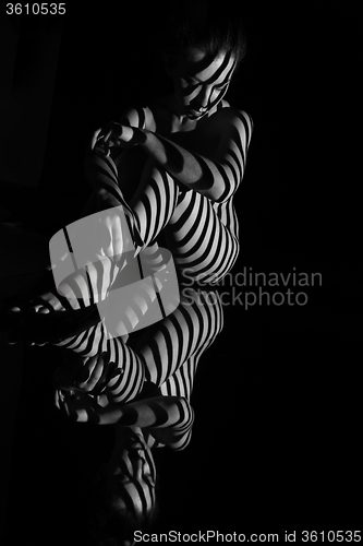 Image of The nude woman with black and white zebra stripes