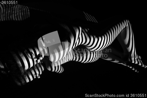 Image of The nude woman with black and white zebra stripes