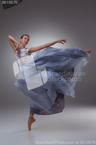 Image of The beautiful ballerina dancing in blue long dress 
