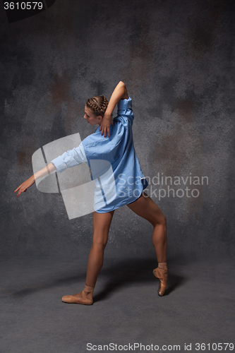 Image of Young beautiful modern style dancer posing on a studio background