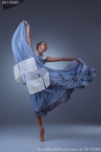 Image of The beautiful ballerina dancing in blue long dress 