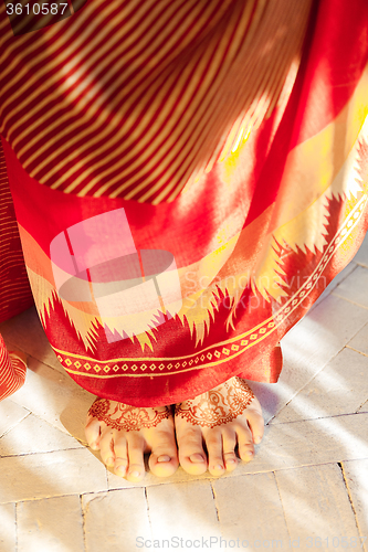 Image of Legs decorated with indian mehandi painted henna 