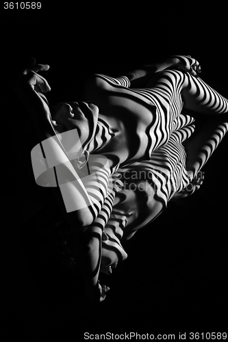 Image of The nude woman with black and white zebra stripes