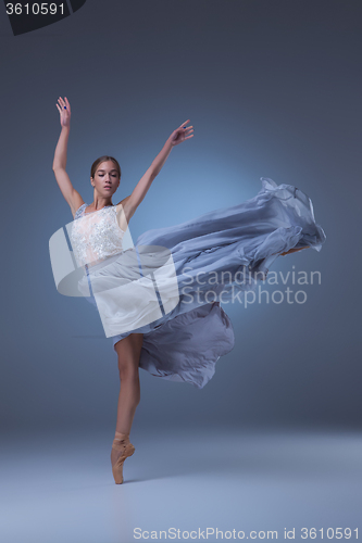 Image of The beautiful ballerina dancing in blue long dress 