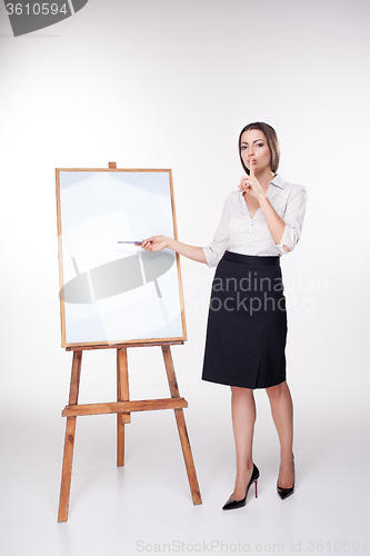 Image of young business woman showing something on the white background