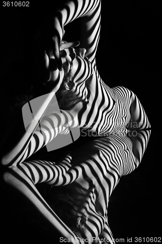 Image of The nude woman with black and white zebra stripes