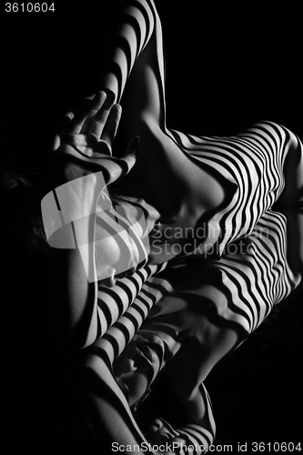 Image of The nude woman with black and white zebra stripes