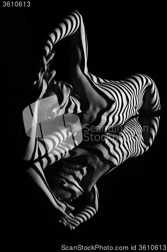 Image of The nude woman with black and white zebra stripes