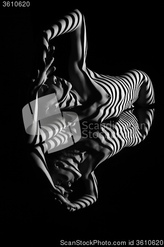 Image of The nude woman with black and white zebra stripes