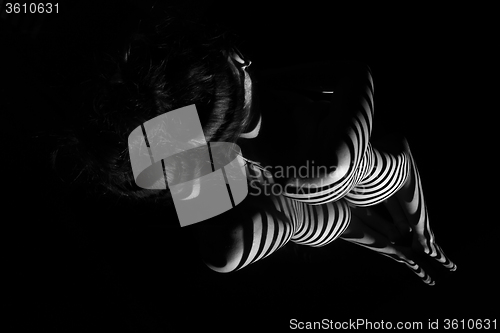 Image of The nude woman with black and white zebra stripes