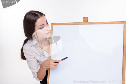 Image of young business woman showing blank signboard on white background