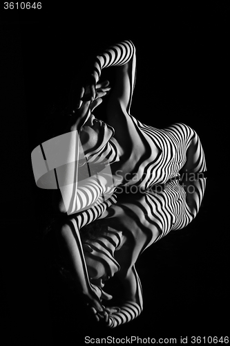 Image of The nude woman with black and white zebra stripes